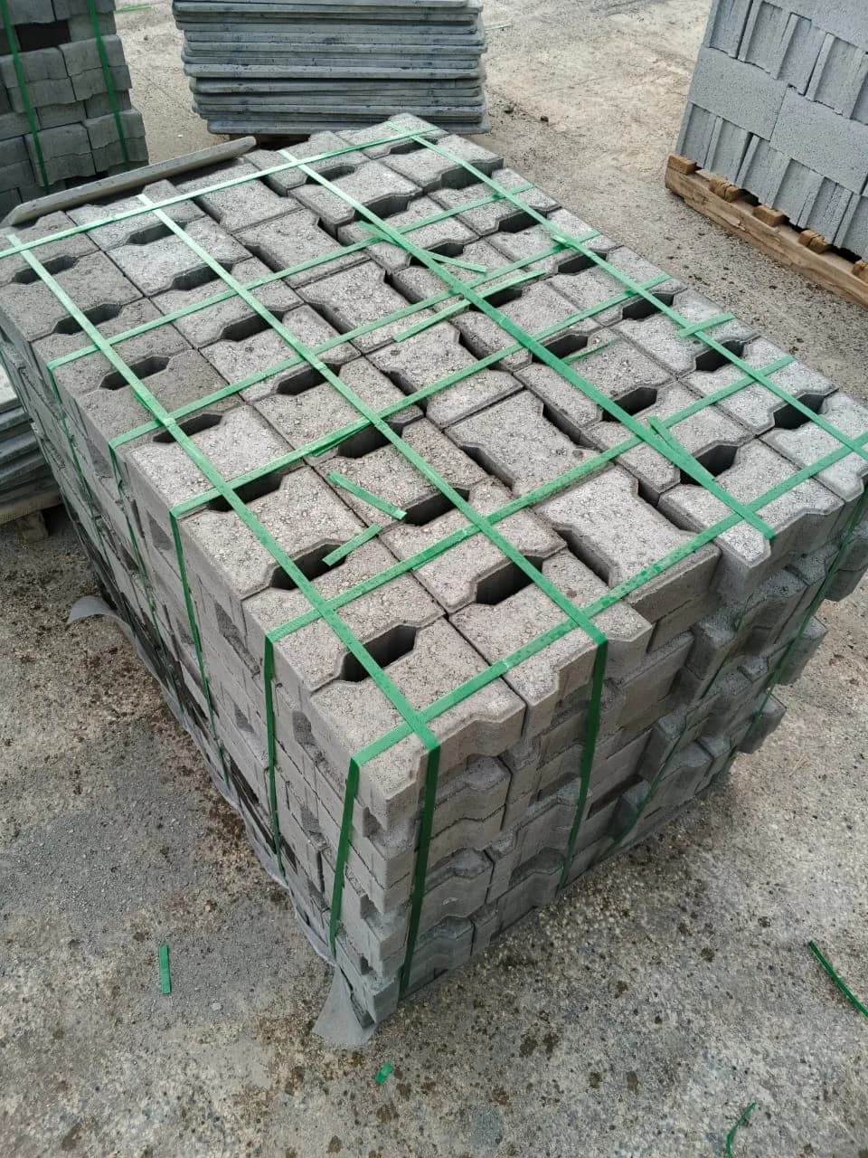 Double T pavers strapped into counted packs on pallets